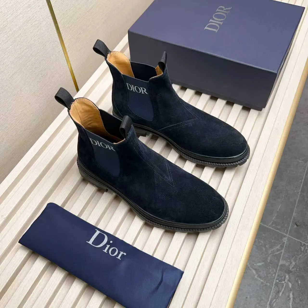 Men's Shoes 💰480 Dior A practical choice that combines protection with classic style. Made from durable Rugged Calf leather, it's tumbled and hand-finished to create a soft suede feel with a rich texture. Elastic side panels and subtle cutouts are inspired by the classic Chelsea boot. Leather upper and lining with Kummel tabs at front and rear, rubber outsole